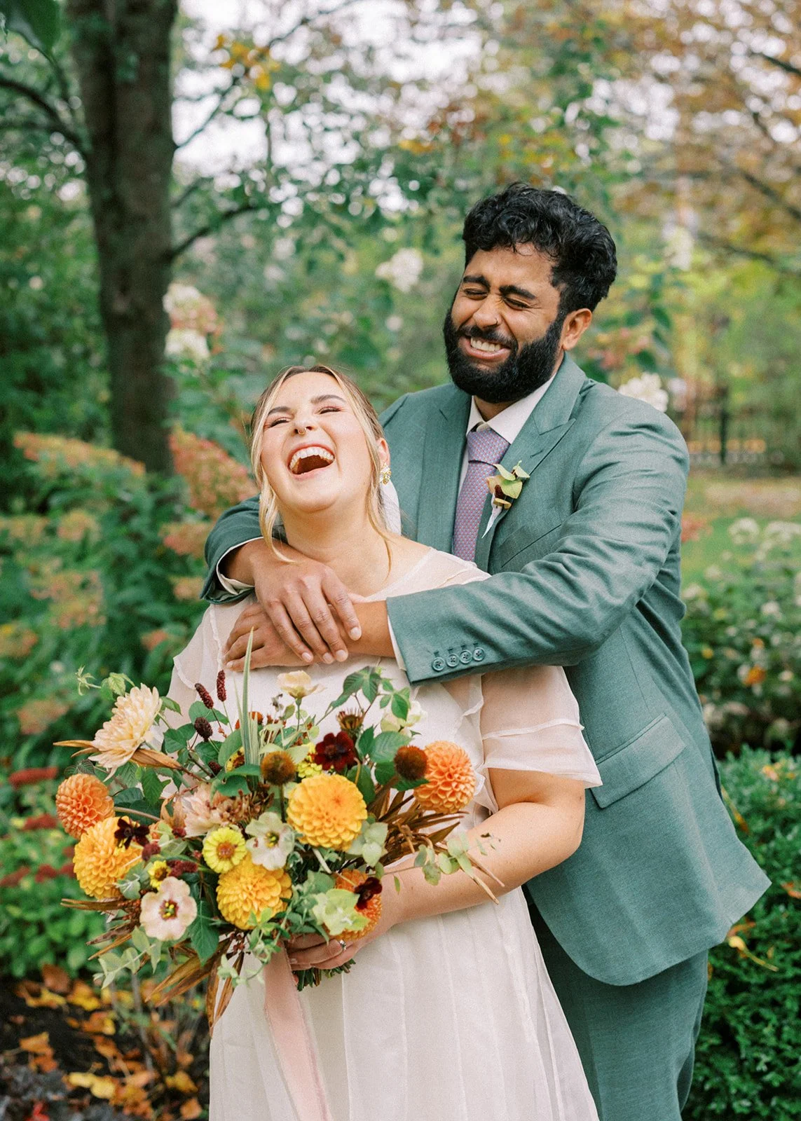 A smiling couple at their Maine barn wedding near Portland