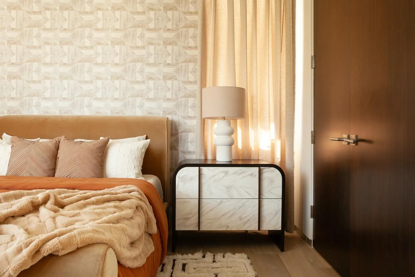 A bedroom that embraces pattern without sacrificing warmth and coziness. #bedroom #pattern #wallpaper