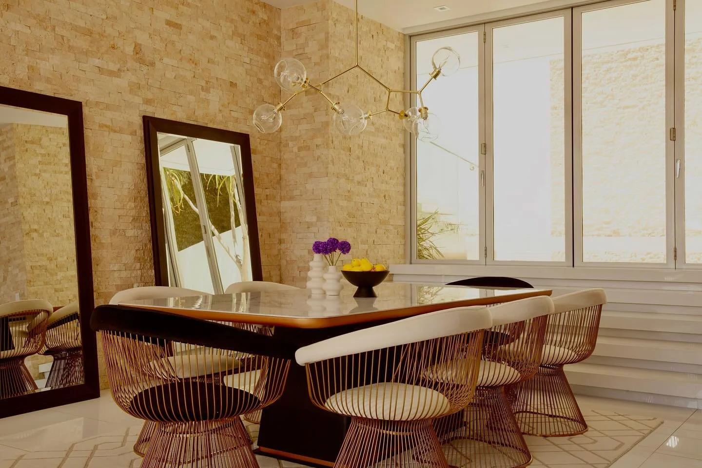 A dining room with sculptural chairs and a statement chandelier. It is a not just a space for hosting and entertaining, it is also where fond memories are made. #diningroom #interiordesign #homestyle