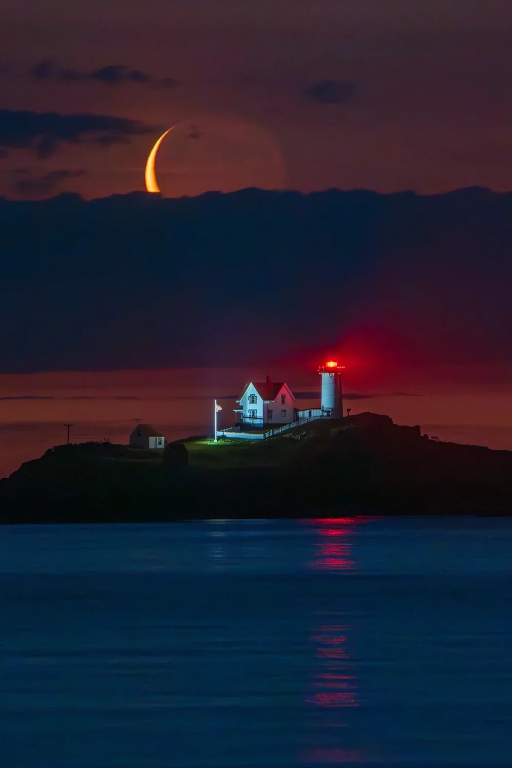 Nubble Lighthouse with crescent moon