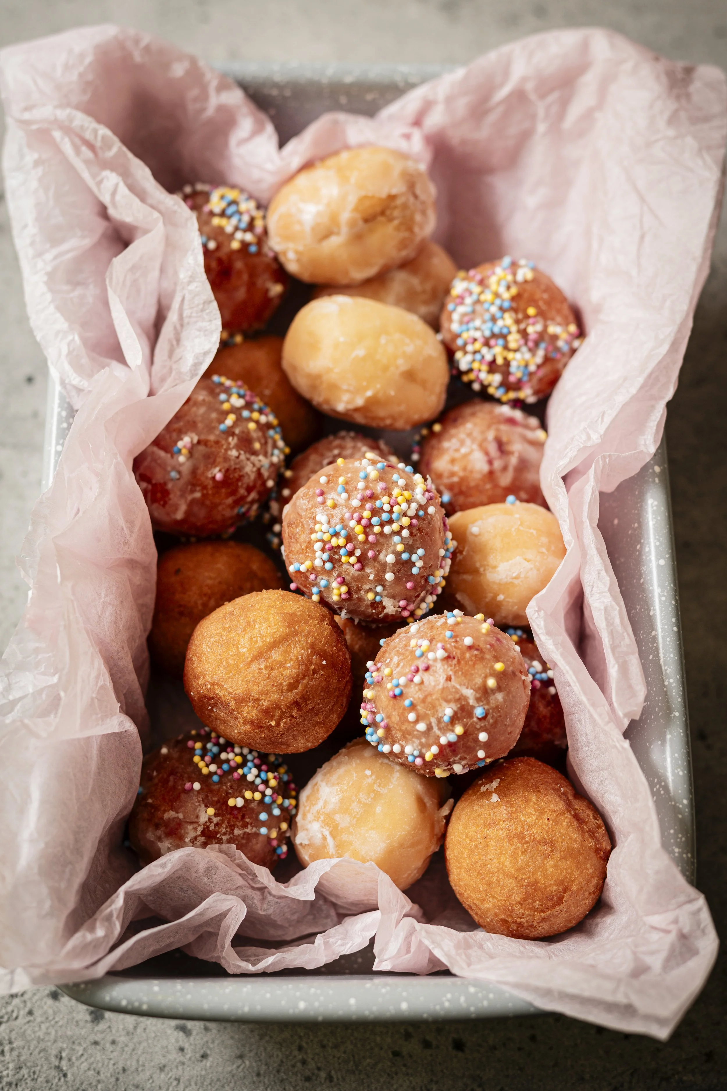 various doughnut holes in a tin.jpg