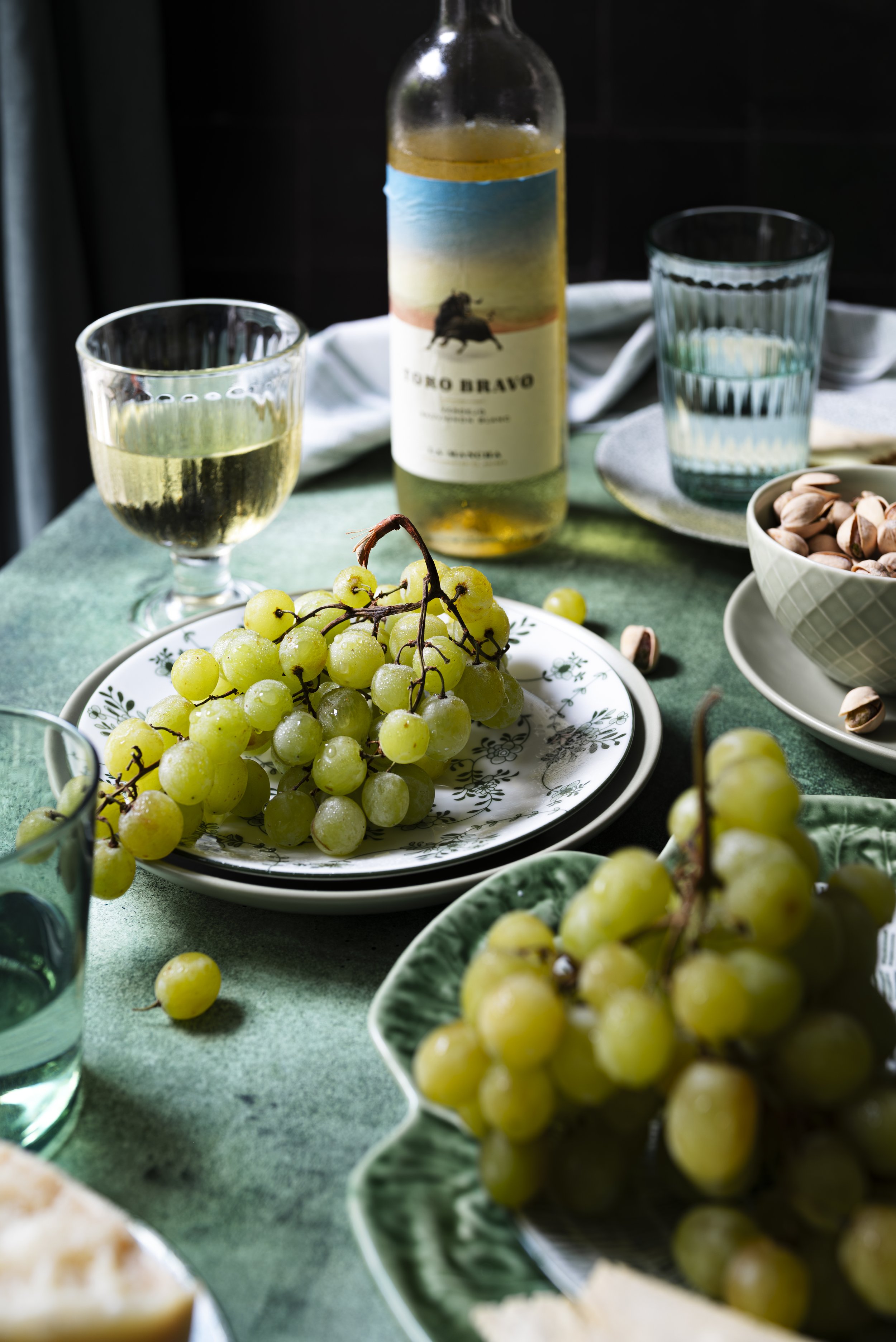 a table scene with wine and grapes.jpg
