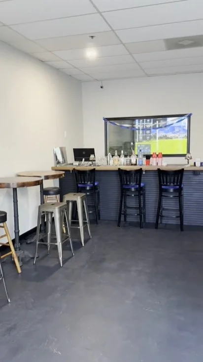 Dry bar with window to golf simulator