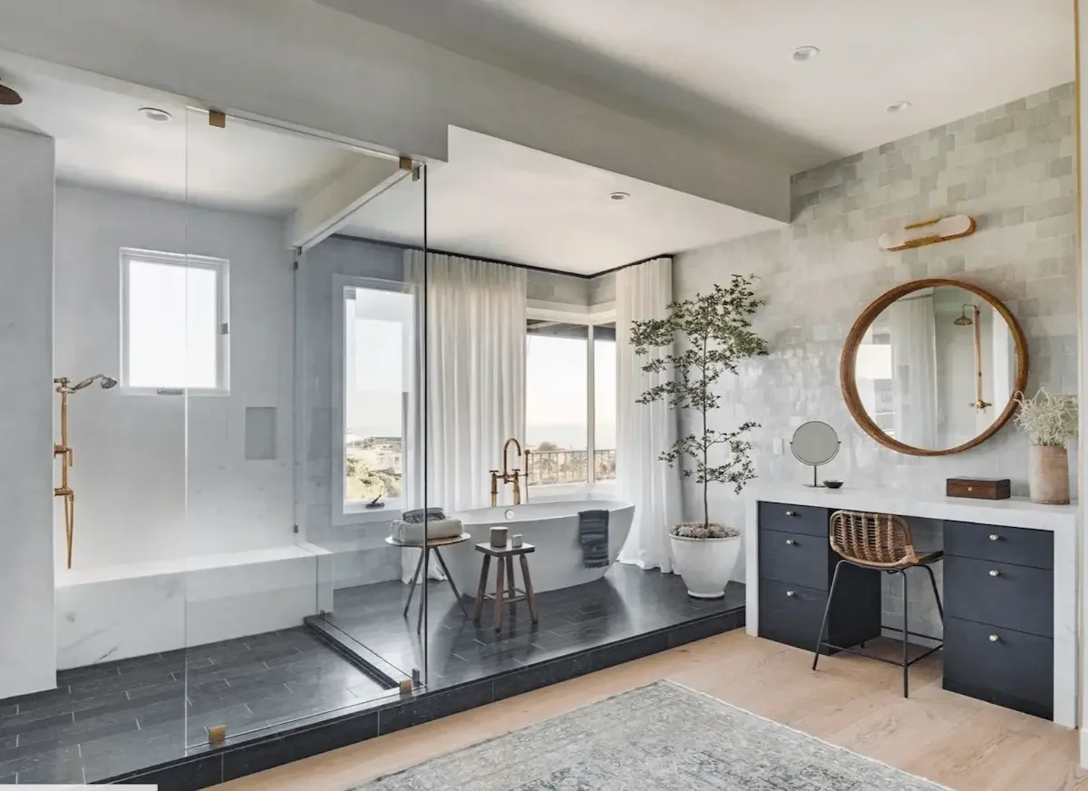 large shower remodel with frameless glass and a stand alone tub