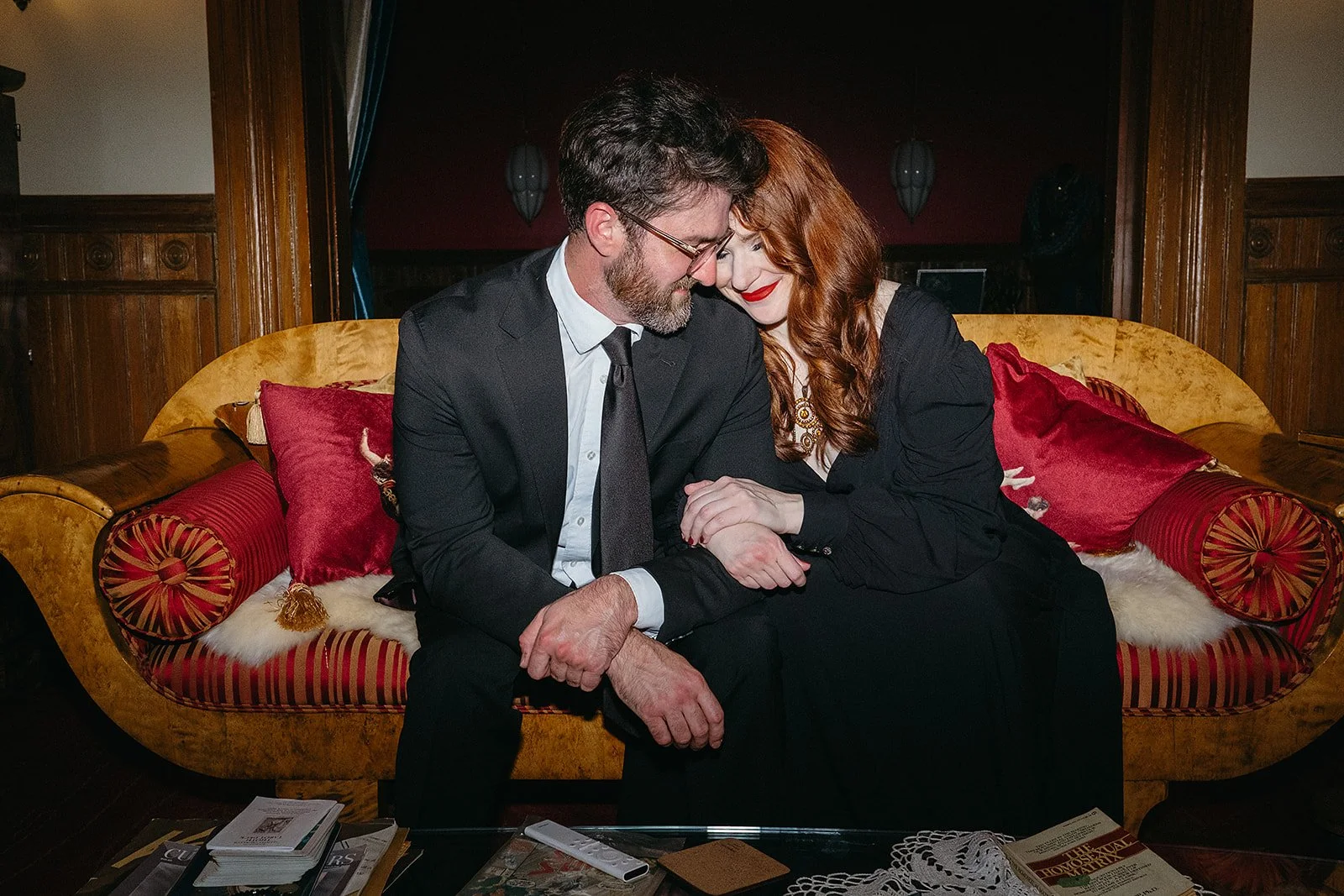 Couple on couch during portrait photography session in the Bywater in New Orleans.