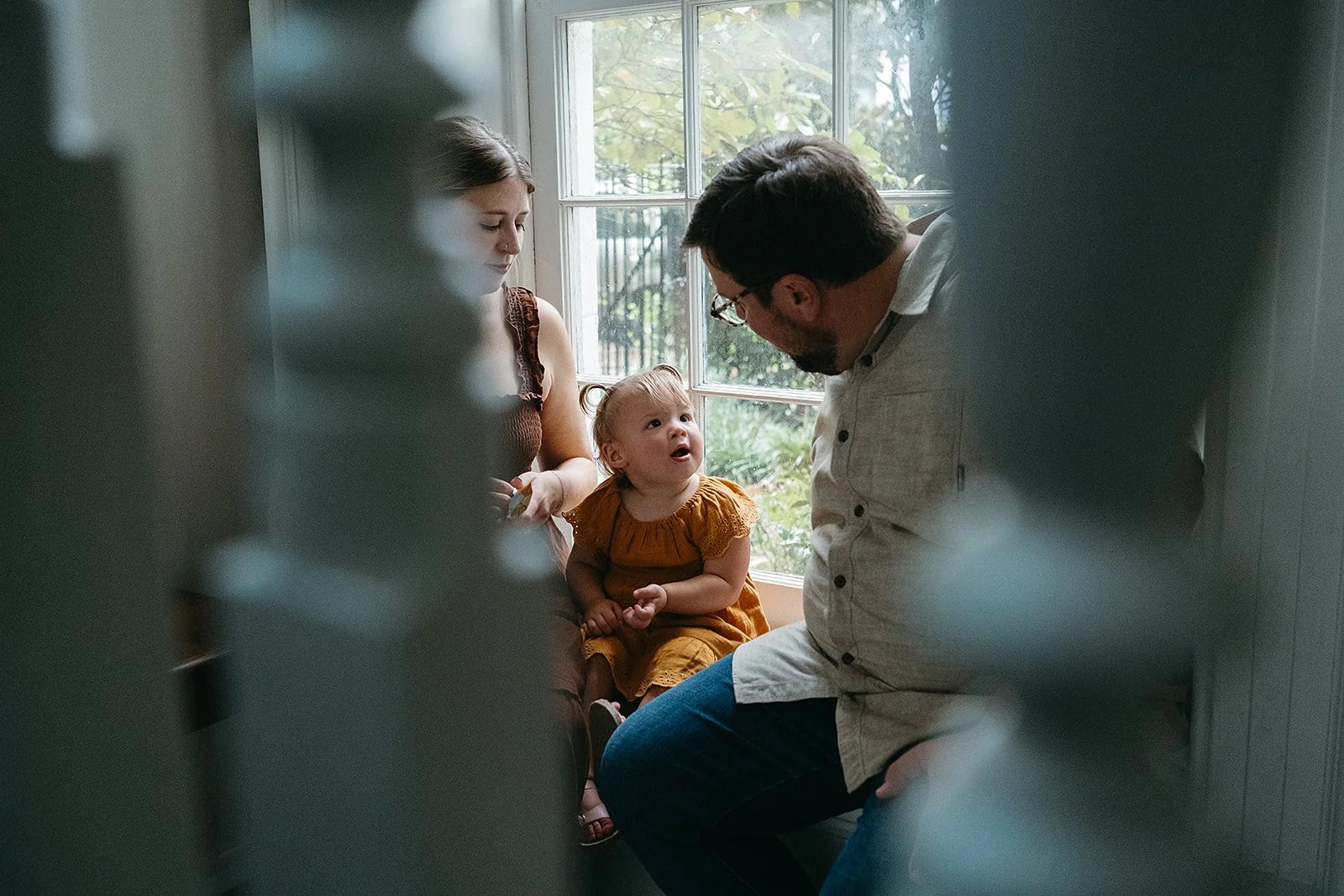 daughter looking at dad during their family photo session at the Felicity church in the lower garden district New Orleans