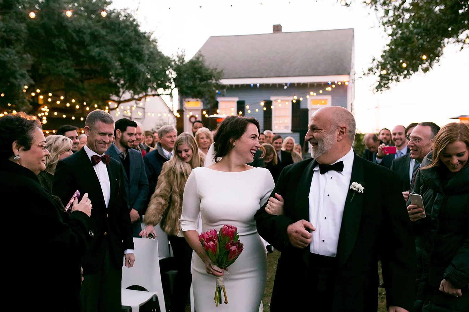 Father walking bride down the aisle on her wedding day in New Orleans. 