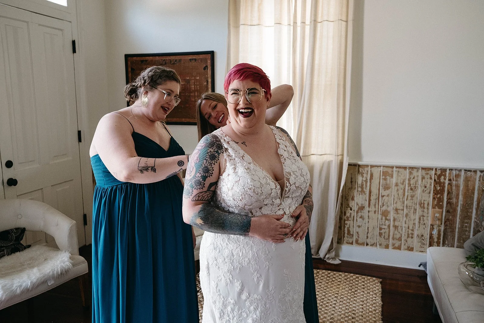 A bride getting her dress on for her New Orleans wedding at Capulet. 