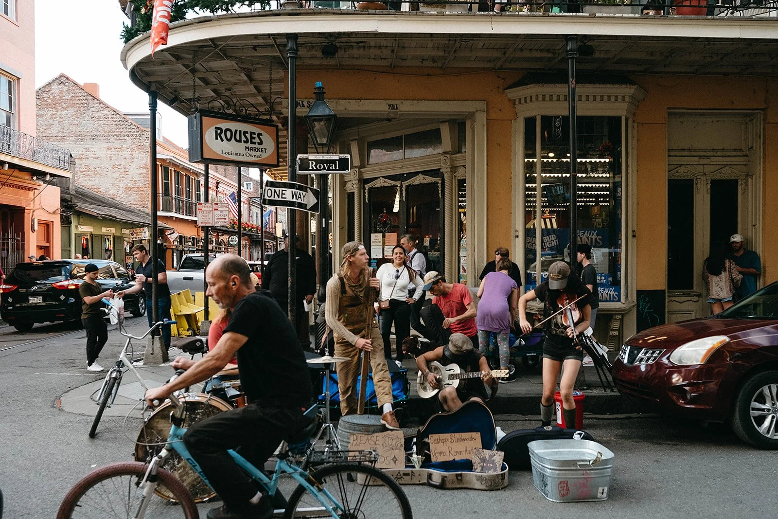 Street photography in the French Quarter on Royal street in front of Rouses with street performers in New Orleans