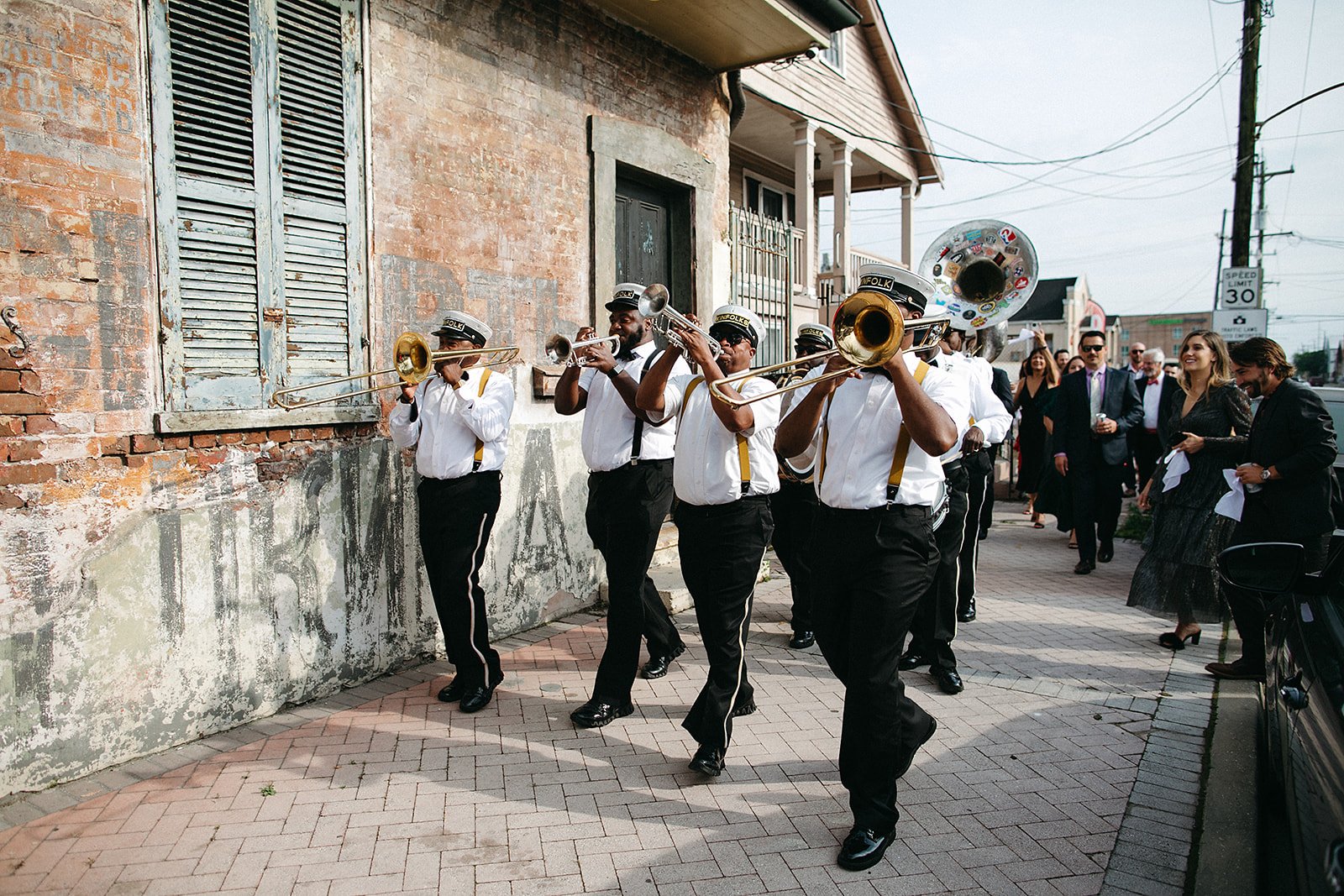 Second Line Band leading a New Orleans wedding from the ceremony to the reception at Race & Religious