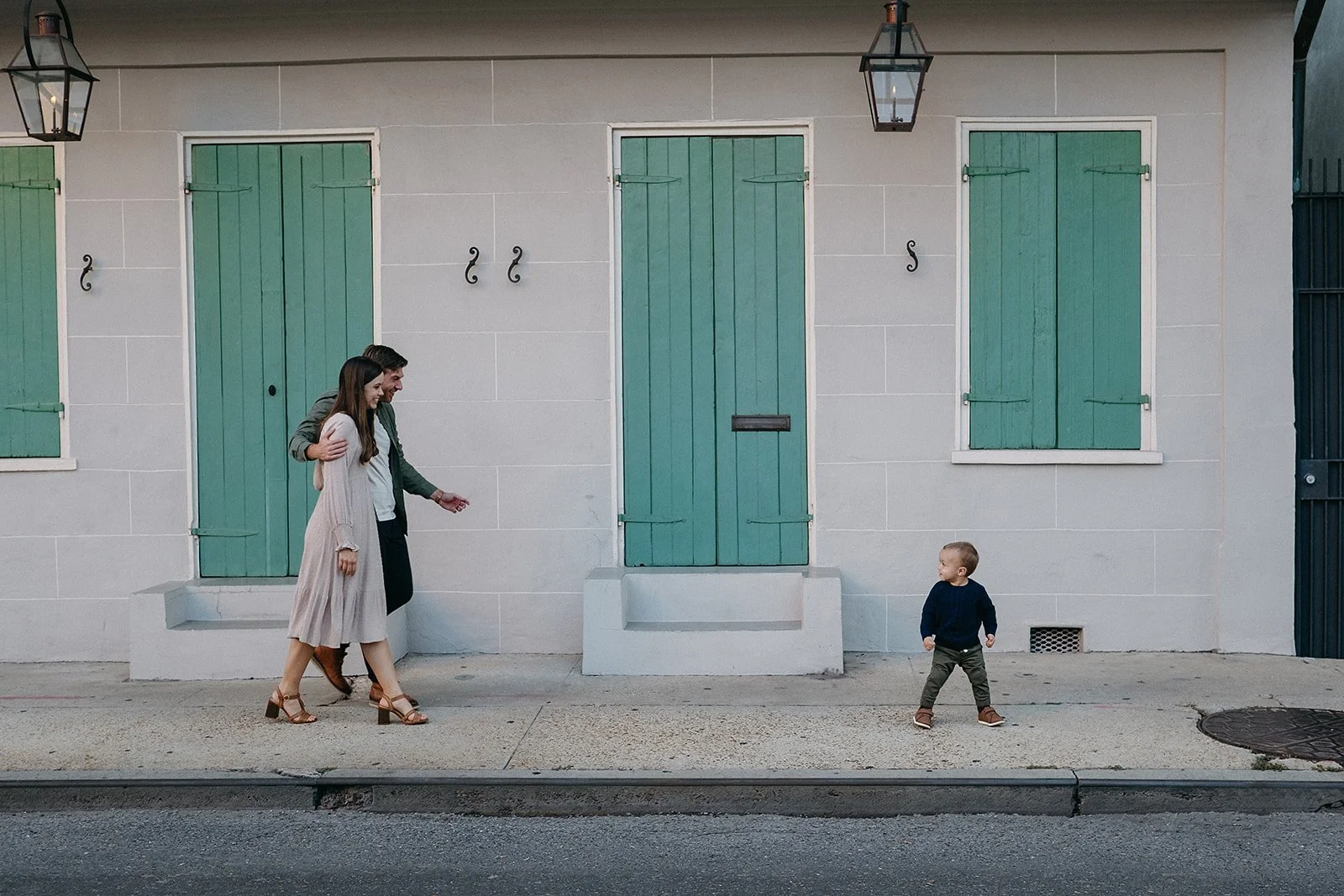 Family photography session in the French Quarter in New Orleans.  French Quarter Shutters and new orleans backdrop.