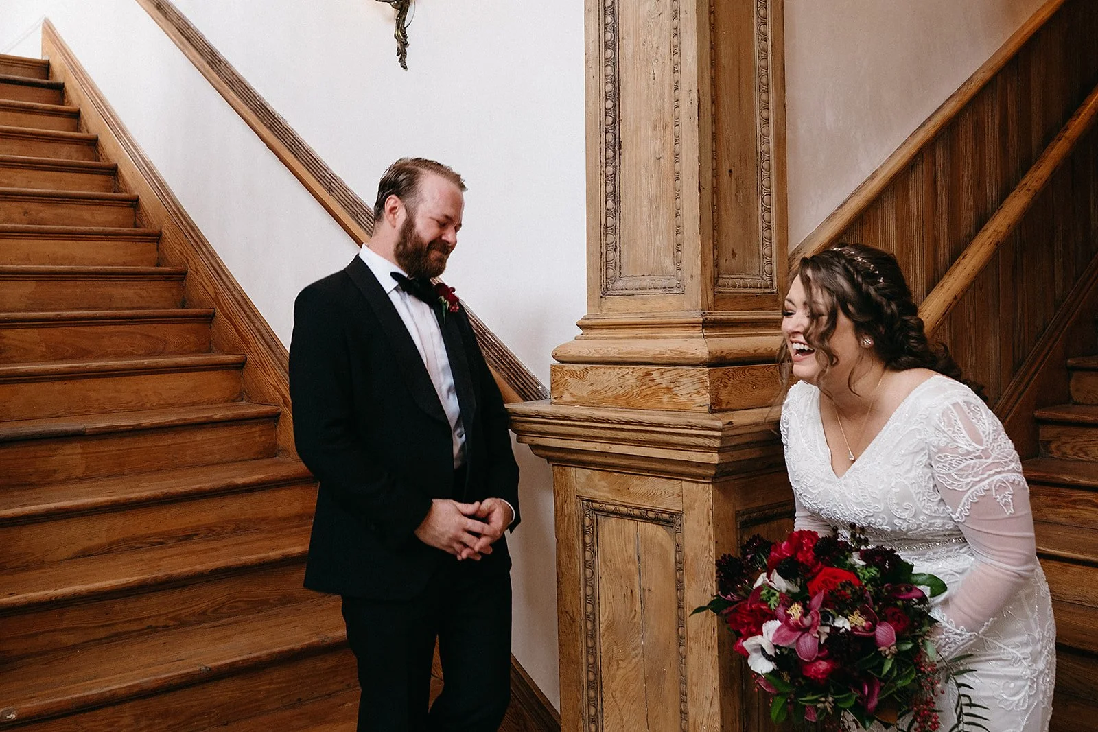 Bride and groom having their first look on the stairs at Hotel Peter & Paul in the 
Faubourg Marigny, New Orleans
