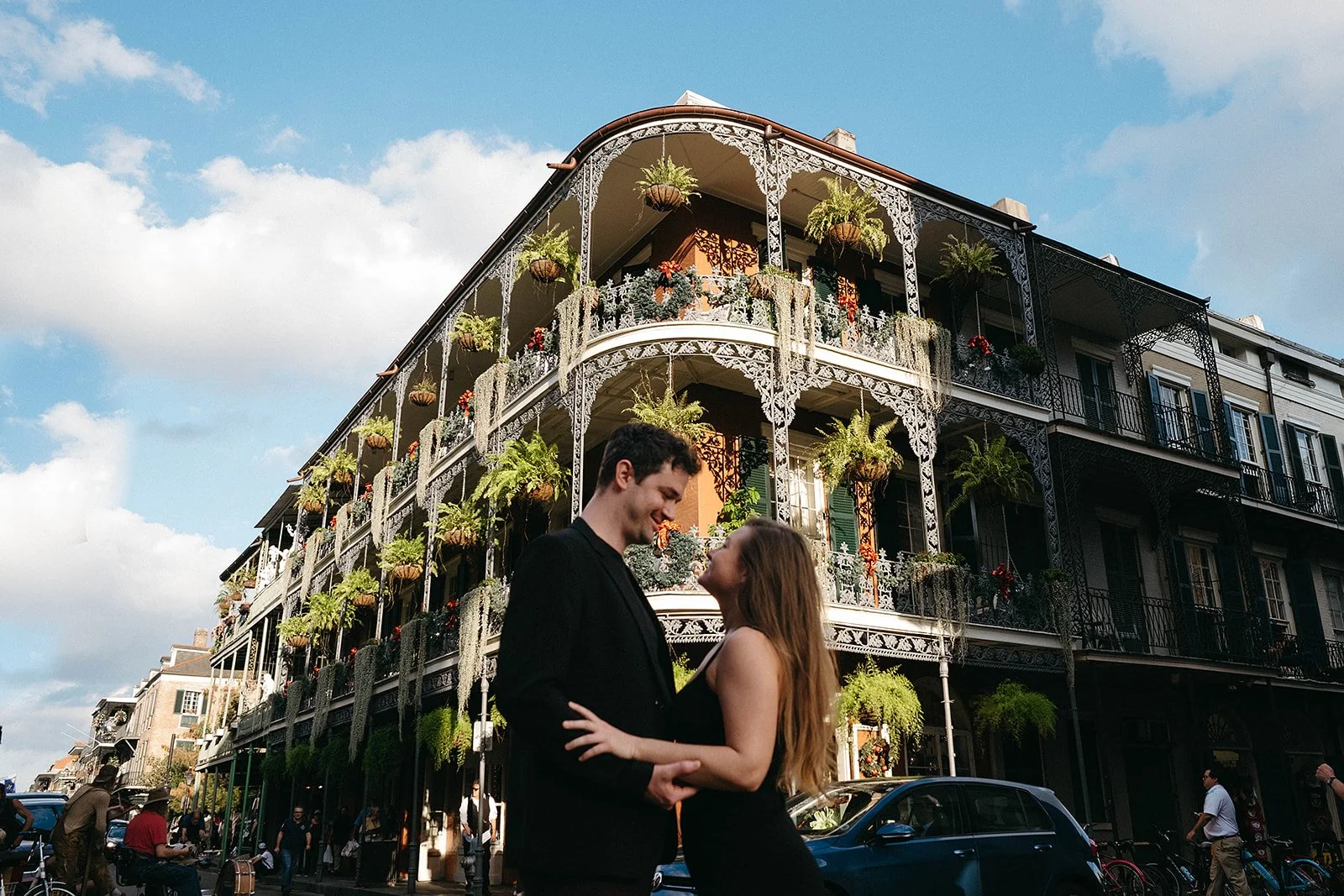 Couple photo session on the streets of the French Quarter in New Orleans.  New Orleans balconies as the backdrop.