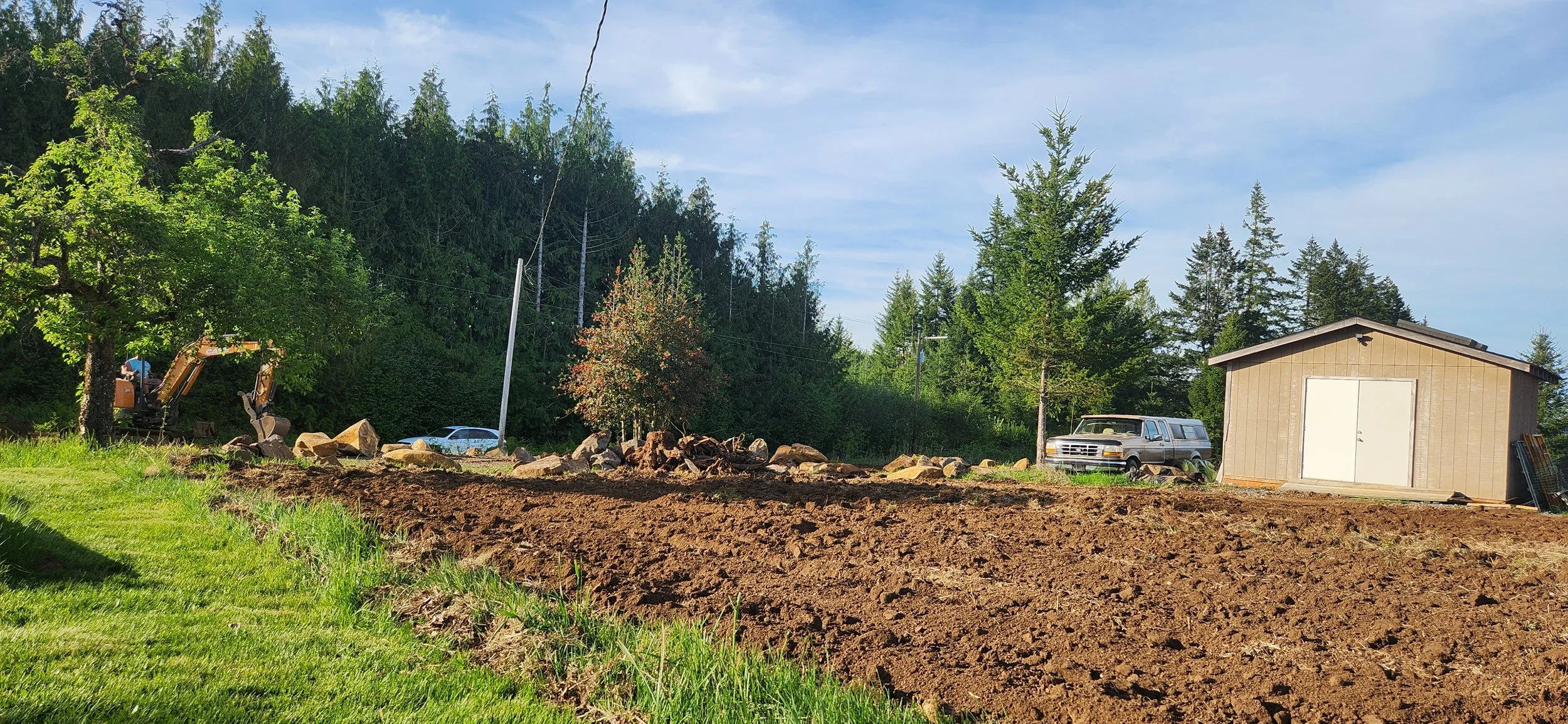 Clearing a wooded farm area and leveling the ground for more usable space — land clearing | North Woods Tree Service