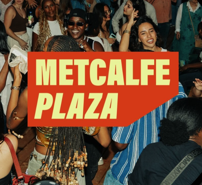 A group of happy people dancing and socializing at a lively event, with a large sign reading 'METCALFE PLAZA' in the foreground.