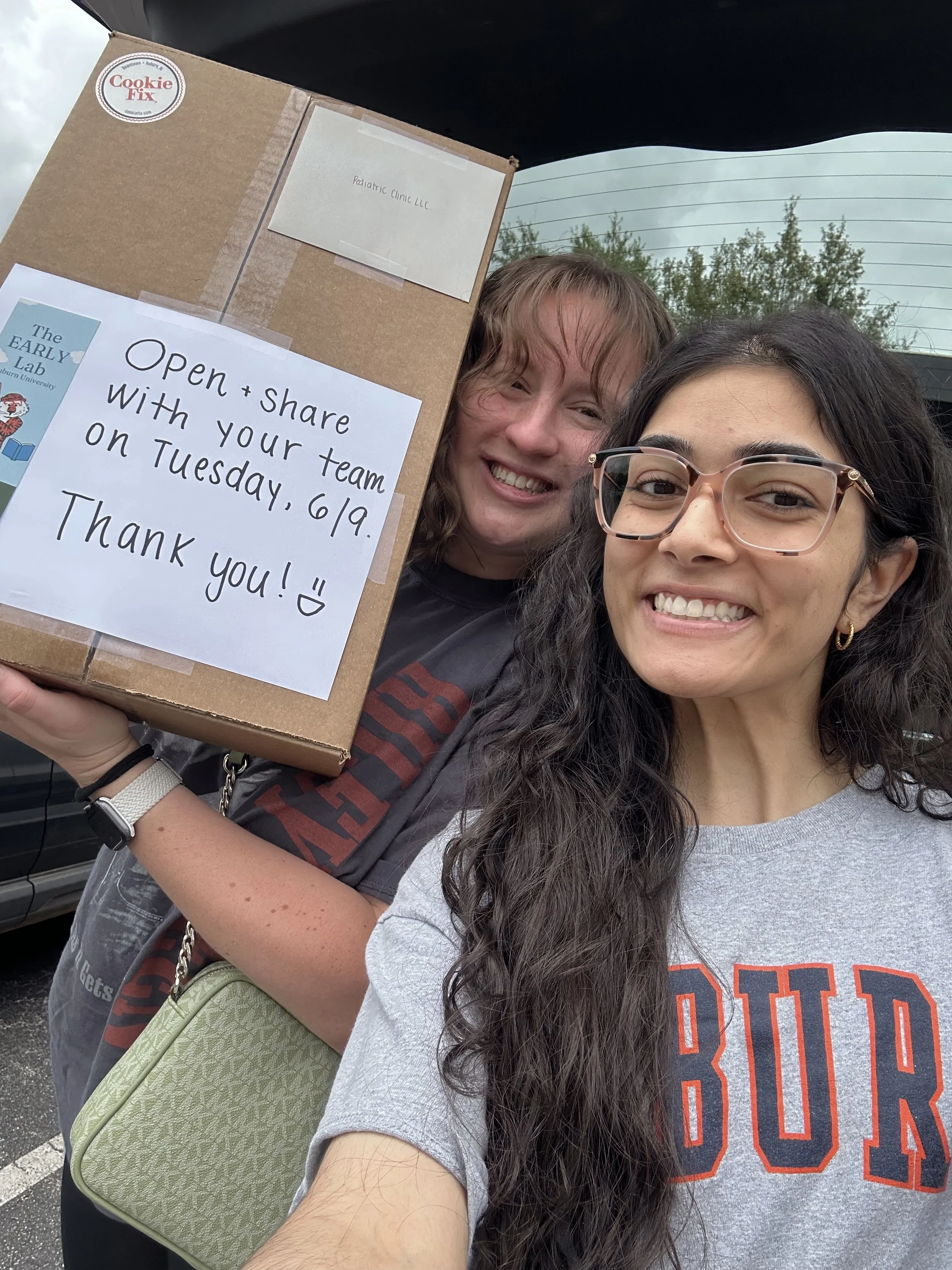 Jamie & Aisha dropping off a thank you gift for one of our amazing pediatric clinic partner!