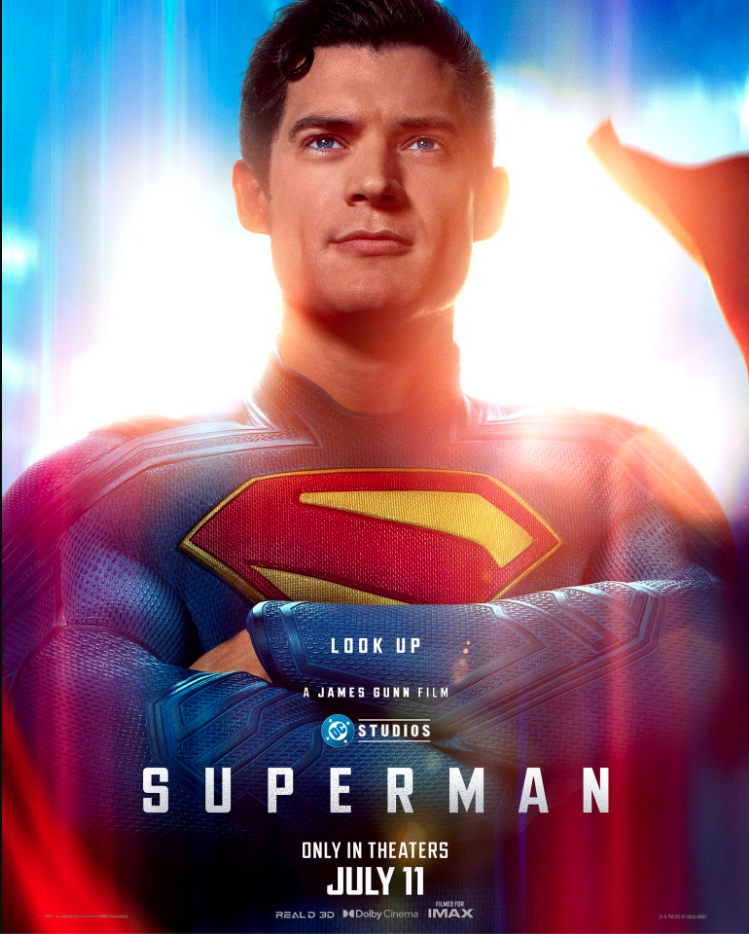 Poster of the movie Superman featuring a close-up of a man in a Superman costume with arms crossed, standing against a bright background with blue and yellow colors. The poster includes text indicating the movie title "Superman," release date "July 11," and mentions of filming for IMAX and Dolby Cinema.