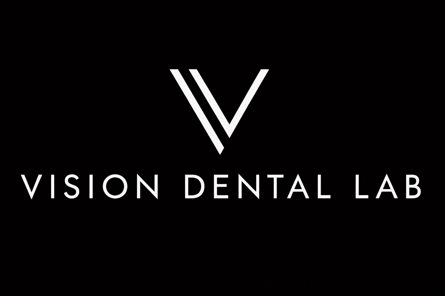 Logo for Vision Dental Lab featuring a stylized 'V' and the text 'Vision Dental Lab'.