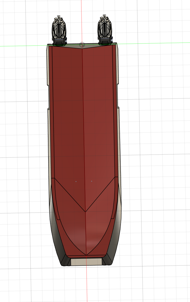 Top view of a ship or boat with a red deck, two white structures at the bow, and a gray hull.