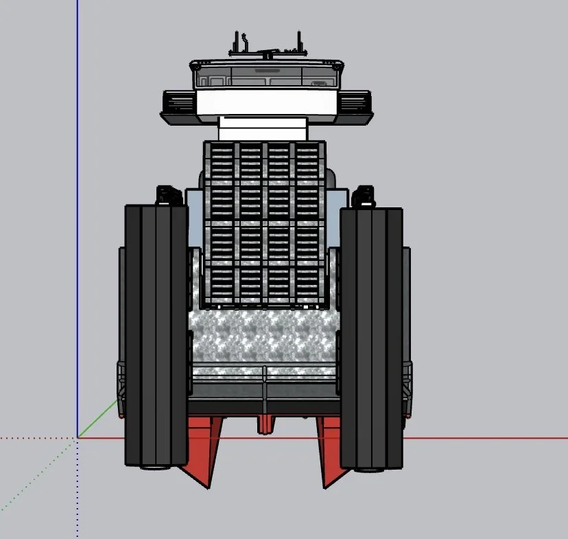 Front view of a large, modern tractor with black tires and a detailed engine section, viewed from below.