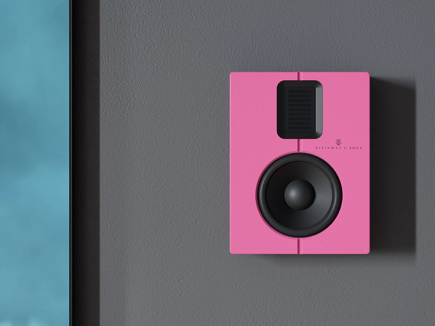 Pink studio monitor speaker mounted on a gray wall.