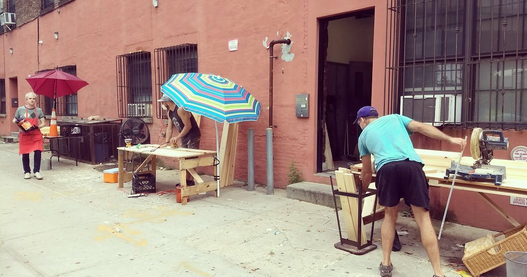 Kraus' workers building handmade folding farm tables from solid Pine.
