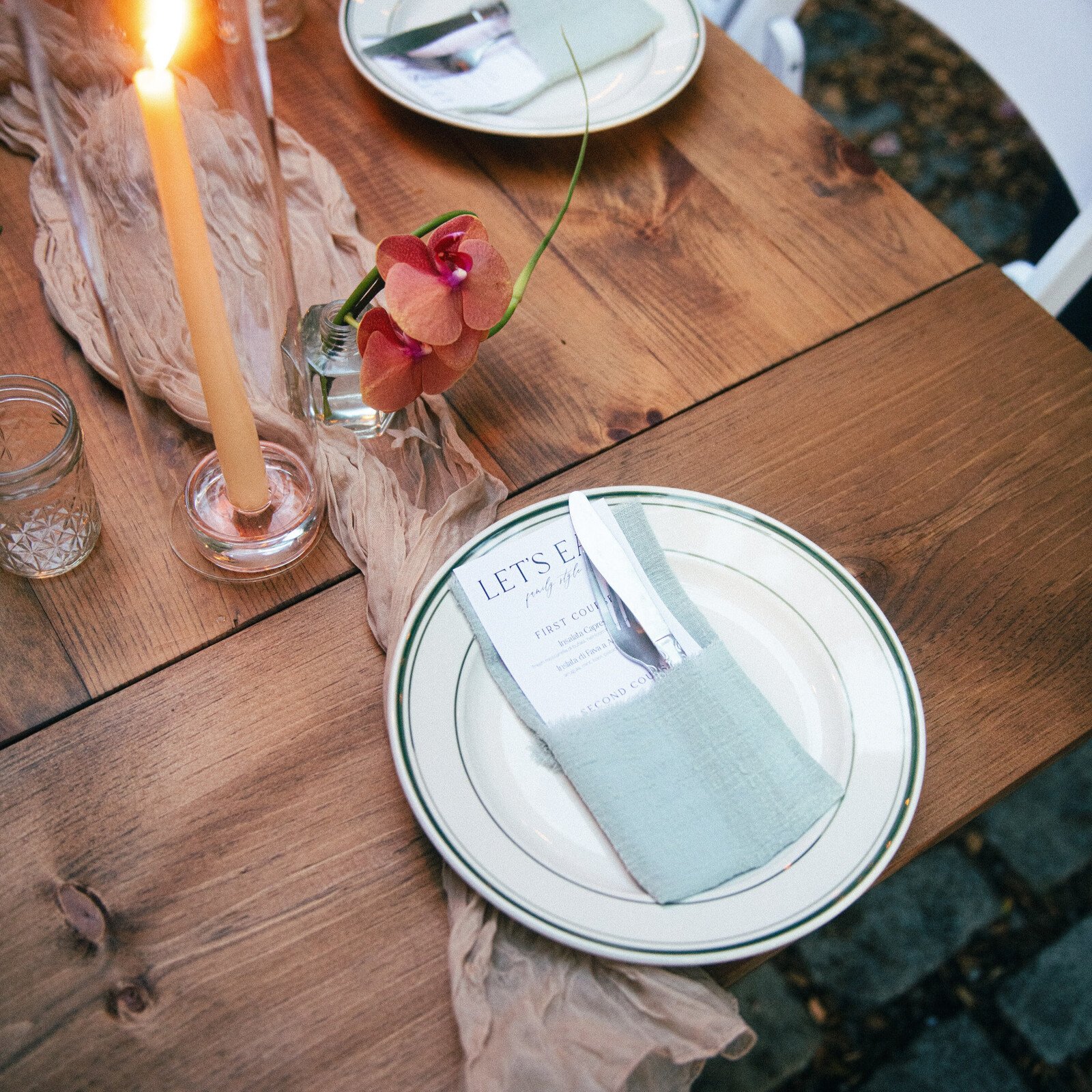 KRAUS folding farm table with end extension leaves, styled tabletop detail