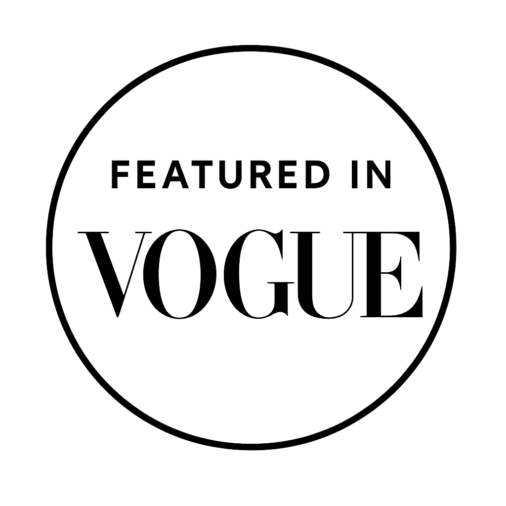 Circle logo with the text "FEATURED IN VOGUE" inside.