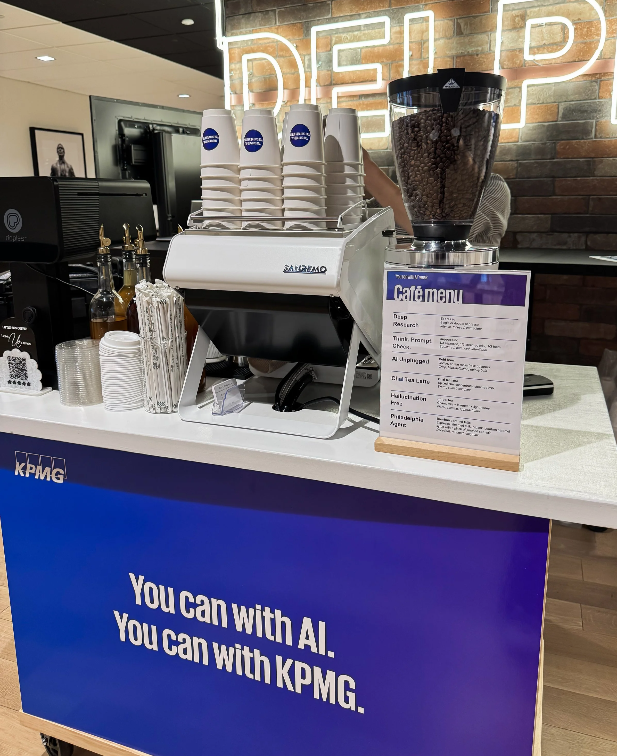 A customized and branded coffee cart in Philadelphia serving a corporate event with printed lattes and a custom menu