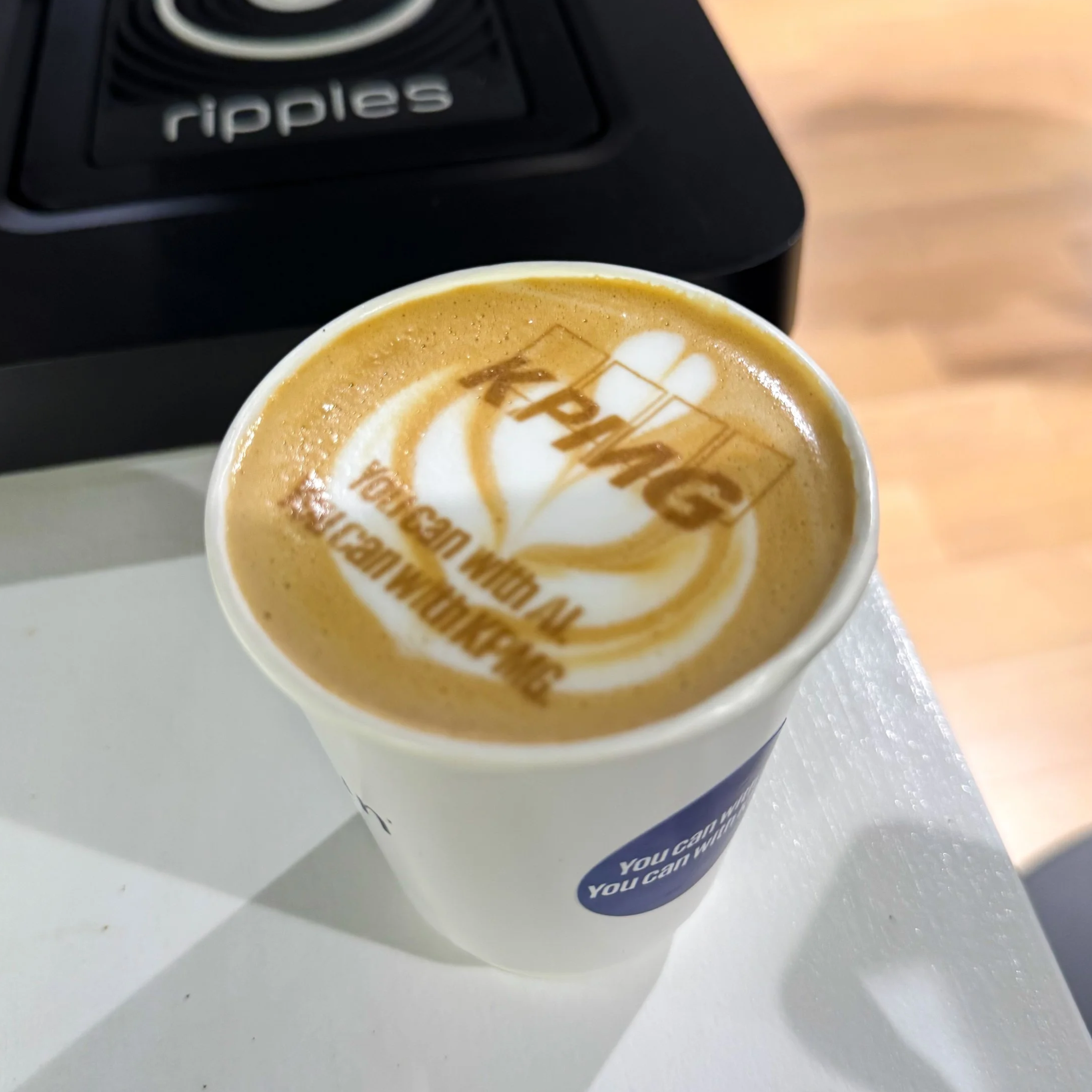 Philadelphia coffee cart catering featuring printed lattes with corporate and brand logos on the coffee.