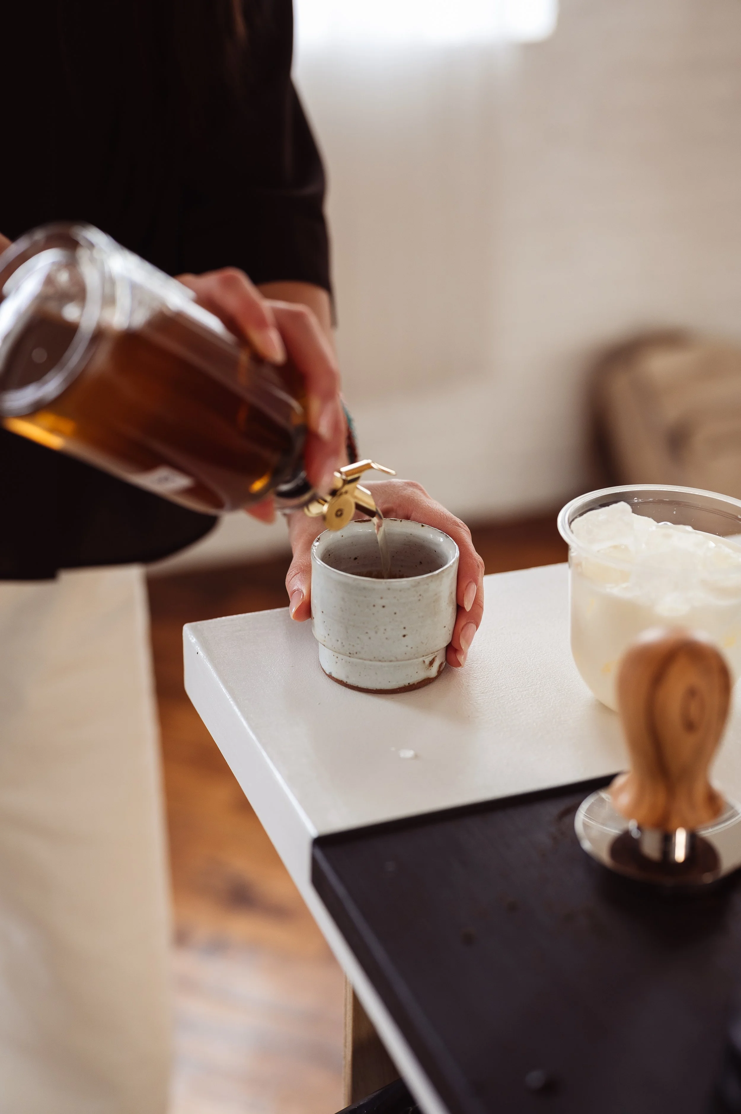 Barista crafting a matcha latte for matcha and coffee catering with a Philadelphia coffee cart