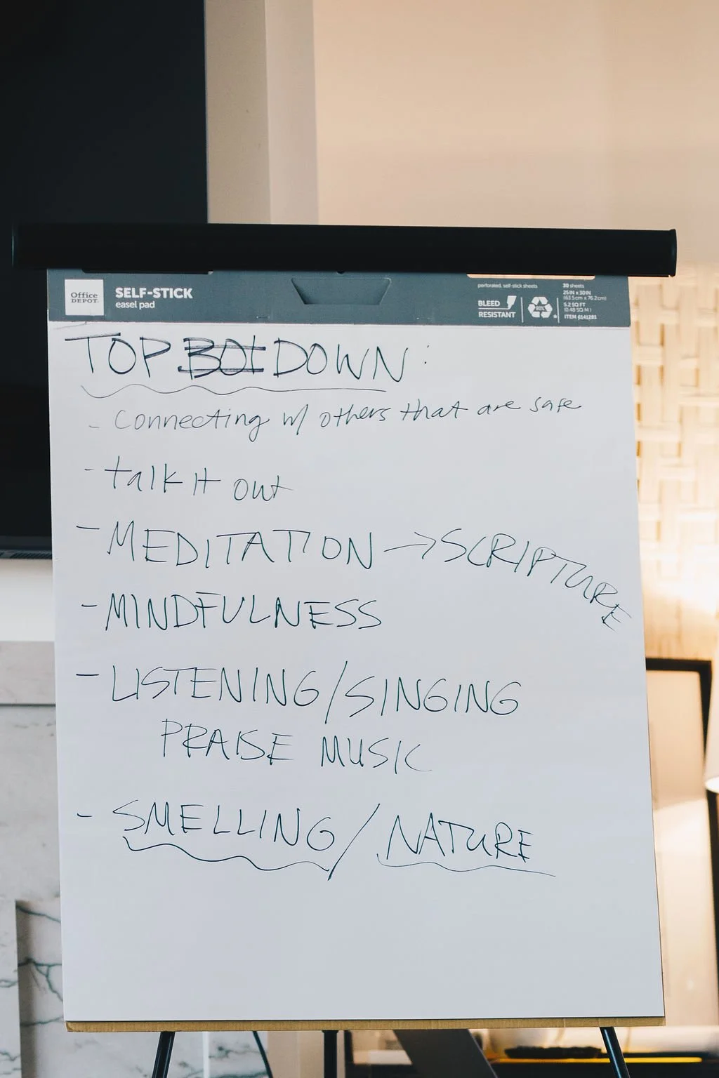 Whiteboard with handwritten notes about top-down meditation, including connecting with others, talking out, meditation, scripture, mindfulness, listening, singing, praise music, and smelling nature.