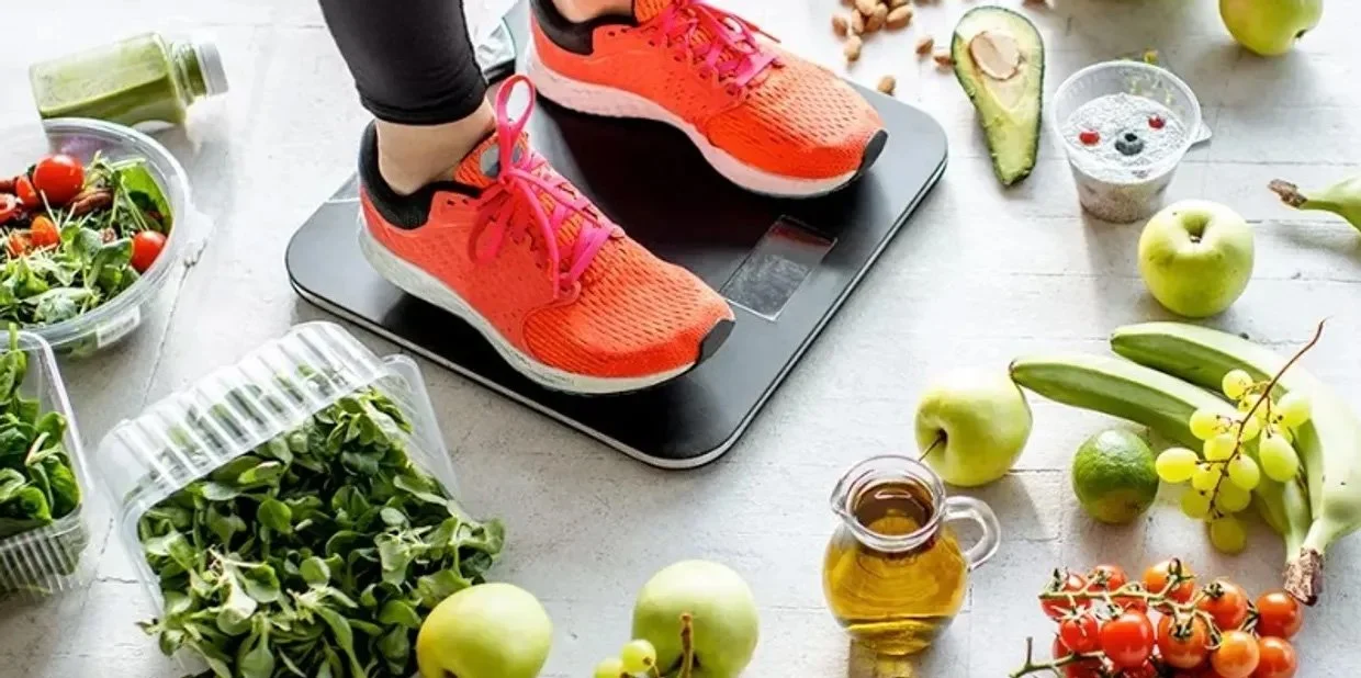 Person On A Scale With Food Around