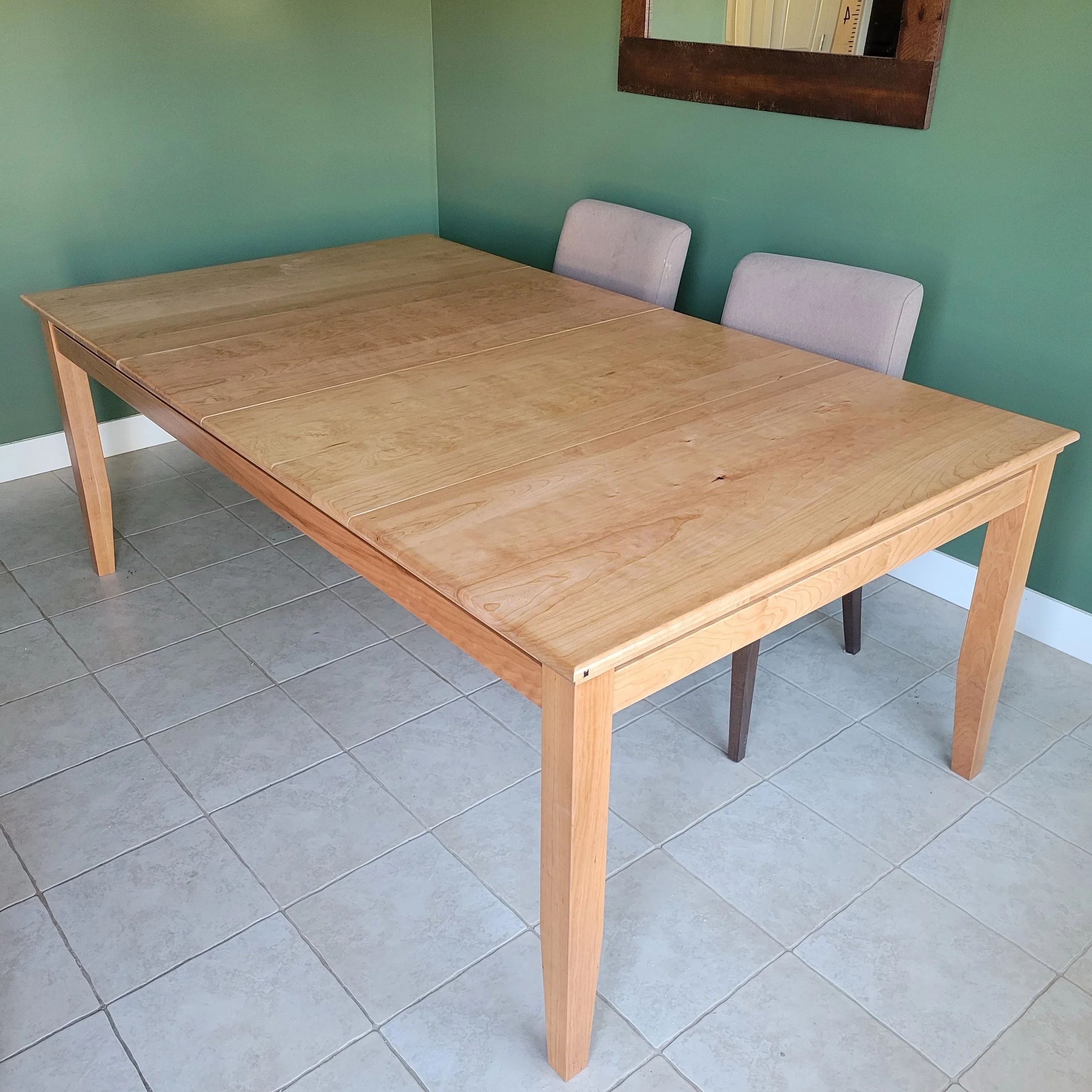 A full picture of a sleek cherry game table with topper panels installed