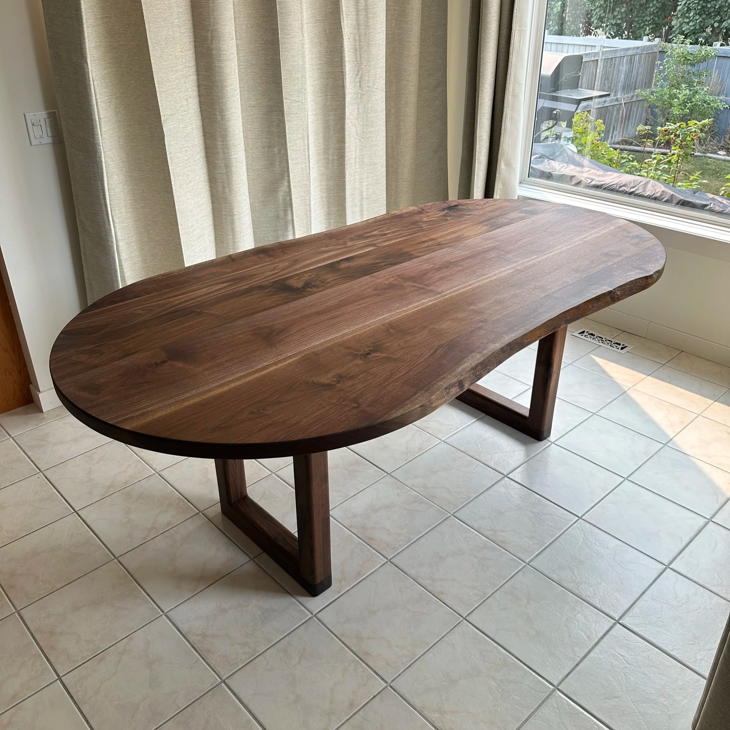 view from the corner of the table showcasing the entire walnut slab used