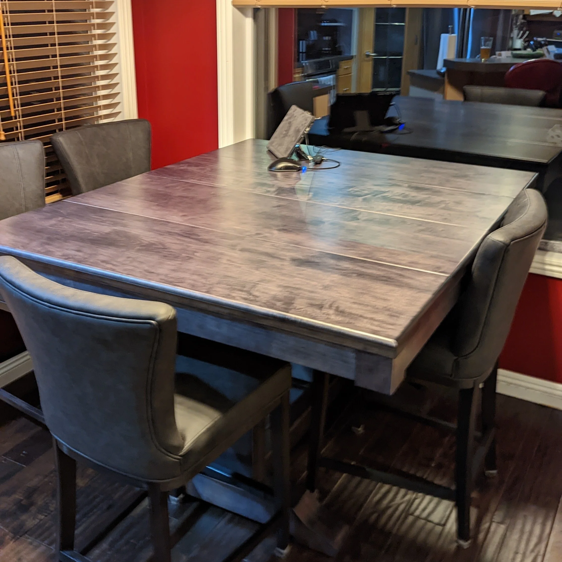 A stained game table with the topper panels installed