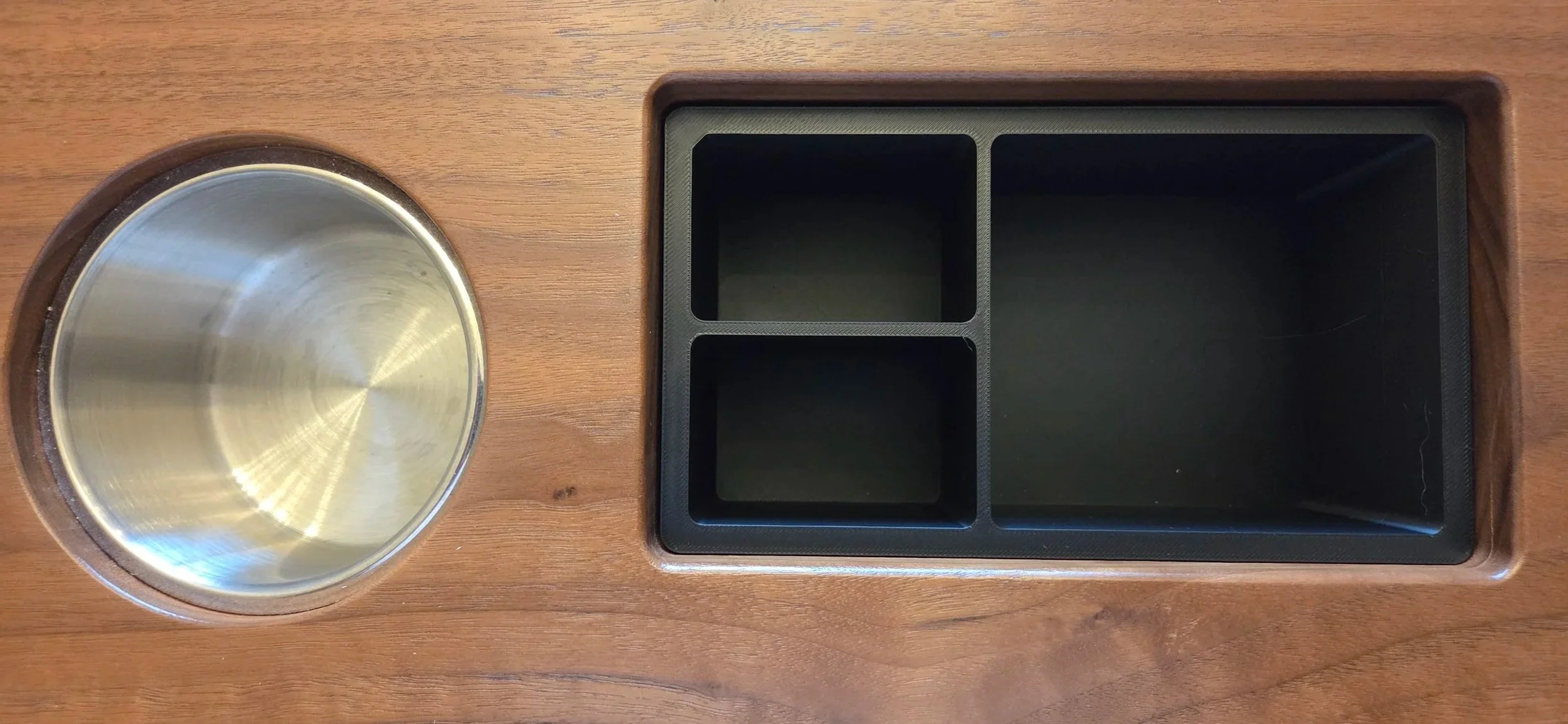 Close up view of the 3d printed dice bin and cup holders integrated into this custom walnut game table