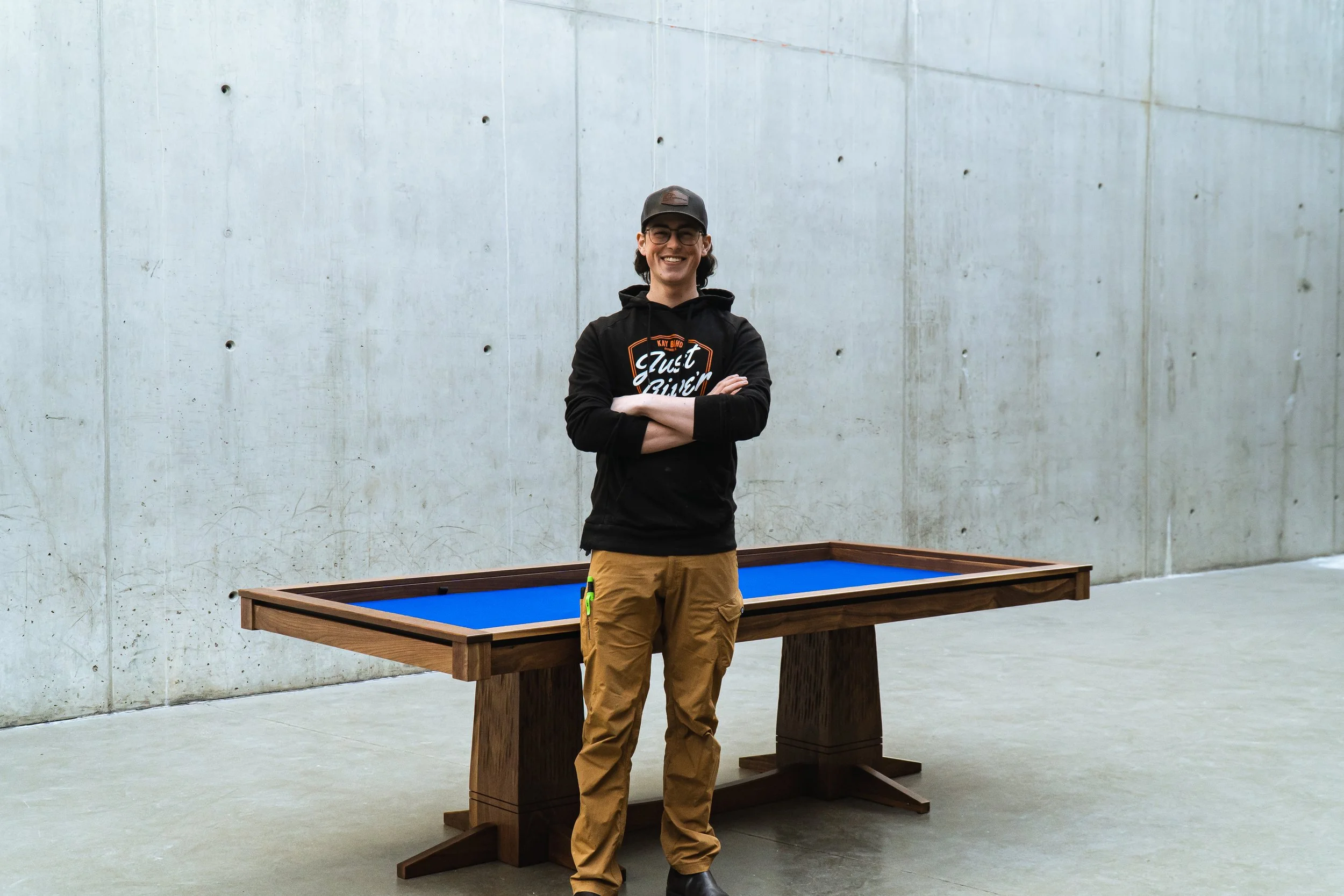 Harley Griffin standing in front of a custom game table