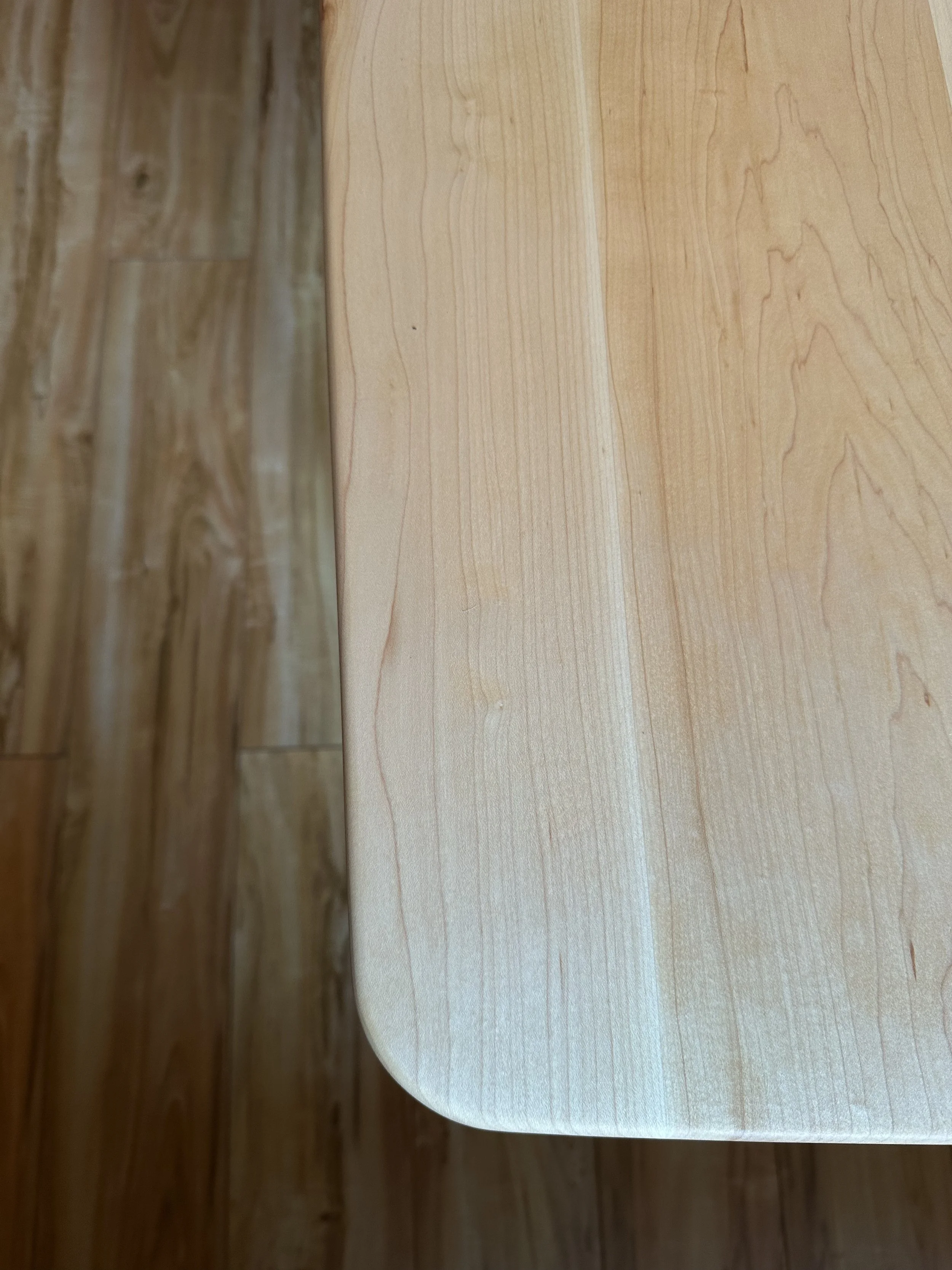 rounded corners flowing into gentle curves along the length and width