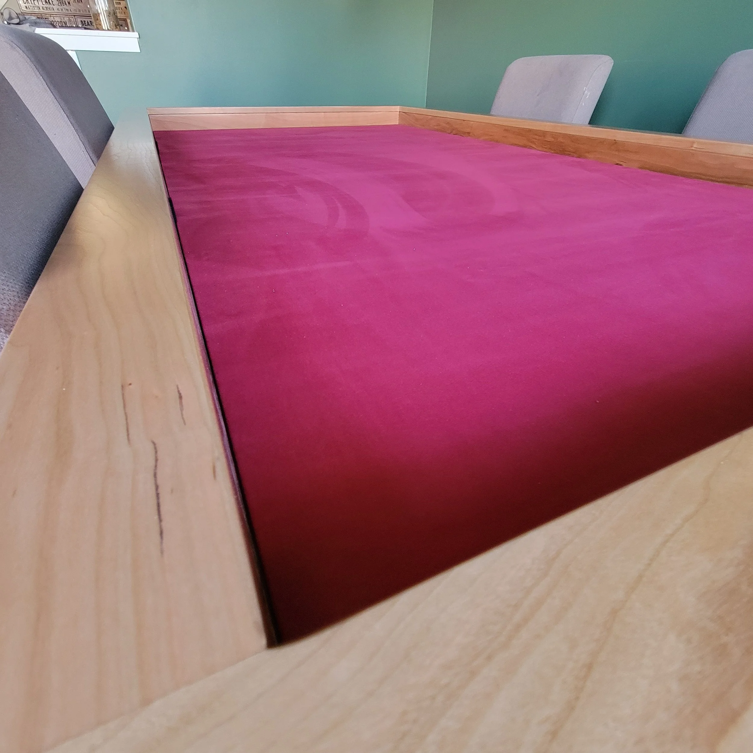 a zoomed in view of the cherry game table looking down its length
