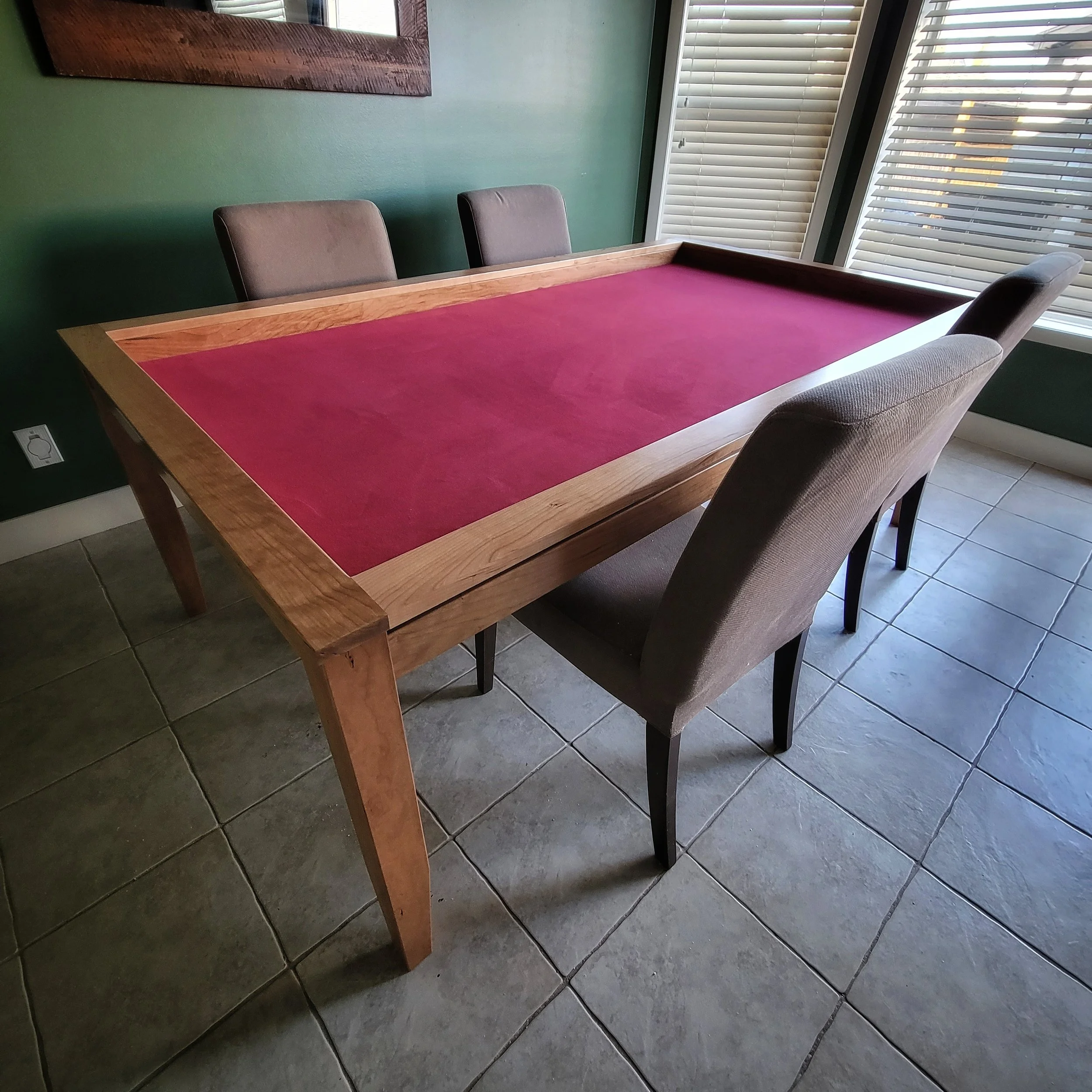 Sleek cherry game table with red neoprene rolling surface