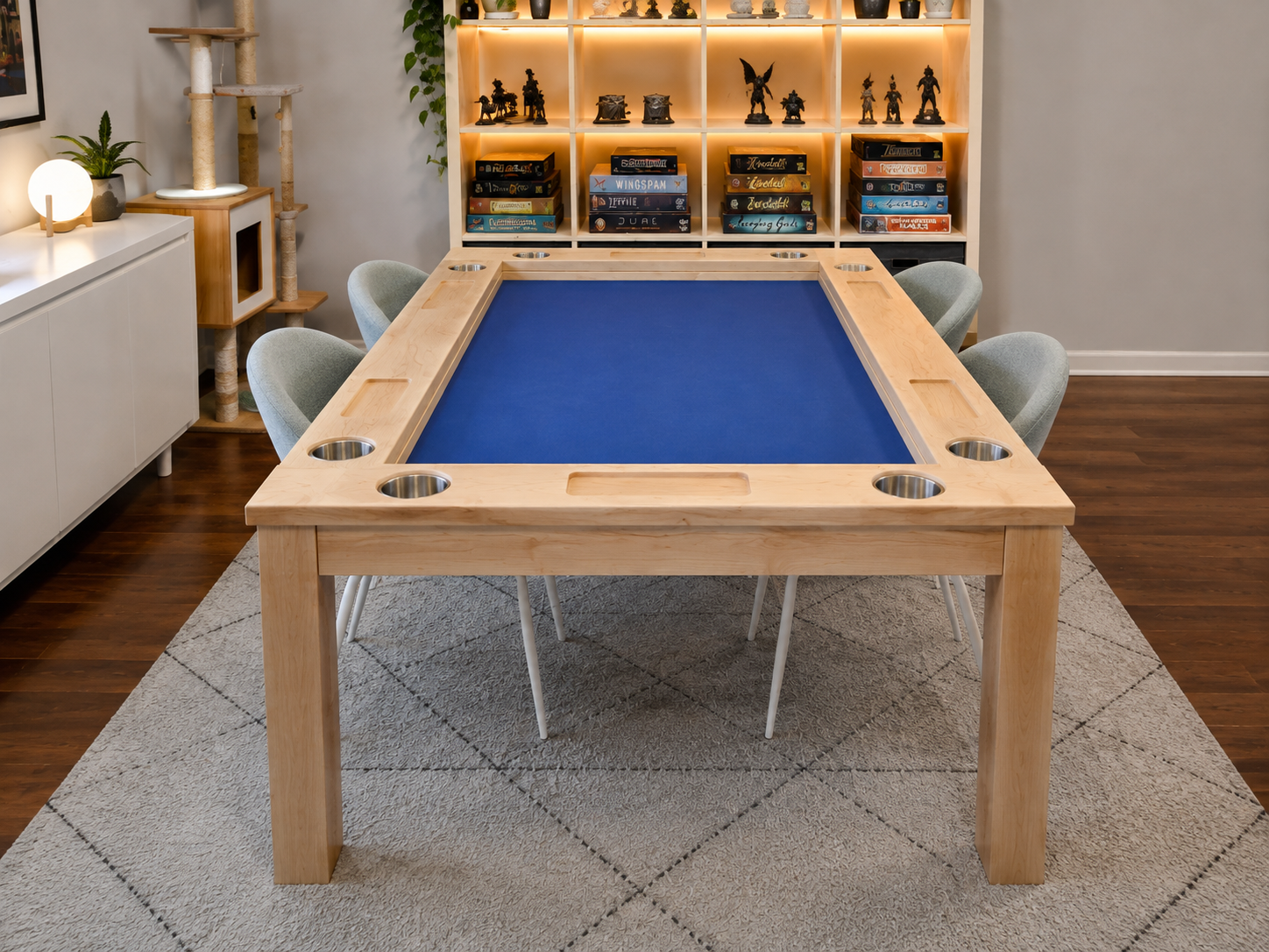 End view of a maple game table with cup holders with a board game bookshelf in the background