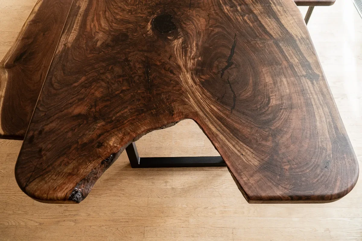 top down view of the end of a live edge table that splits into two separate pieces