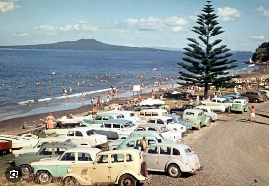 Mairangi Bay beachfront, 1950's vehicles parked at the beach