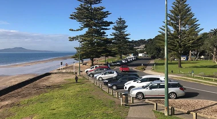Modern cars at the beach front reserve