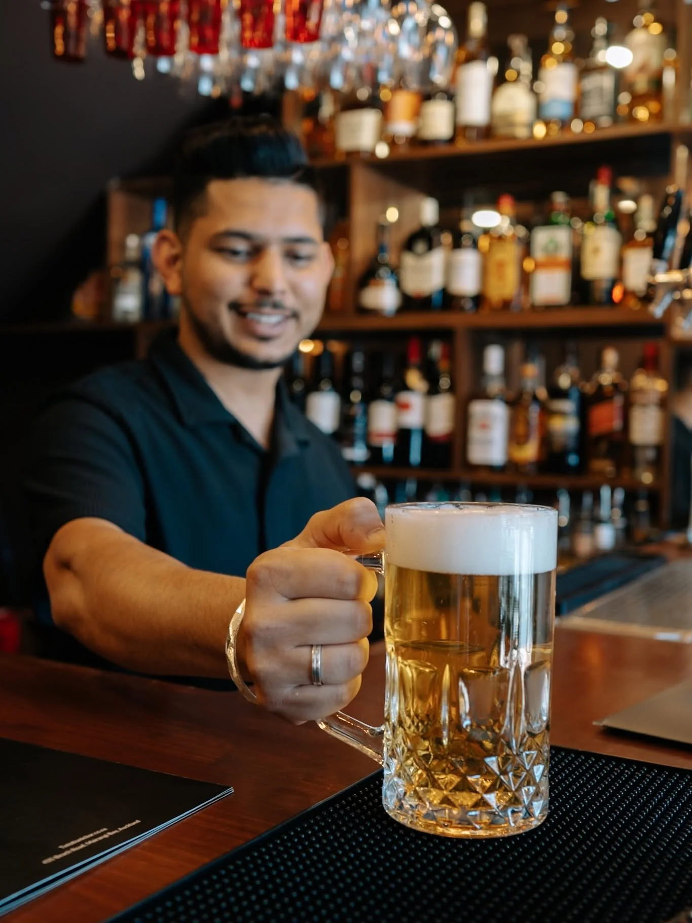 a Tankard of beer being served in Mairangi Bay Village