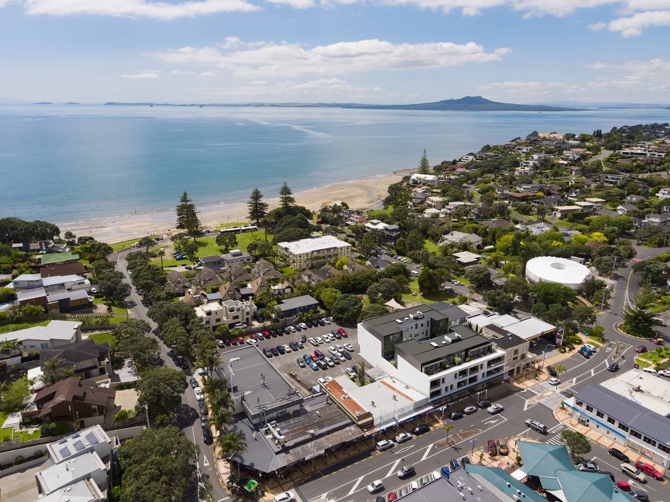 An aerial view of Mairangi Bay Village and beach