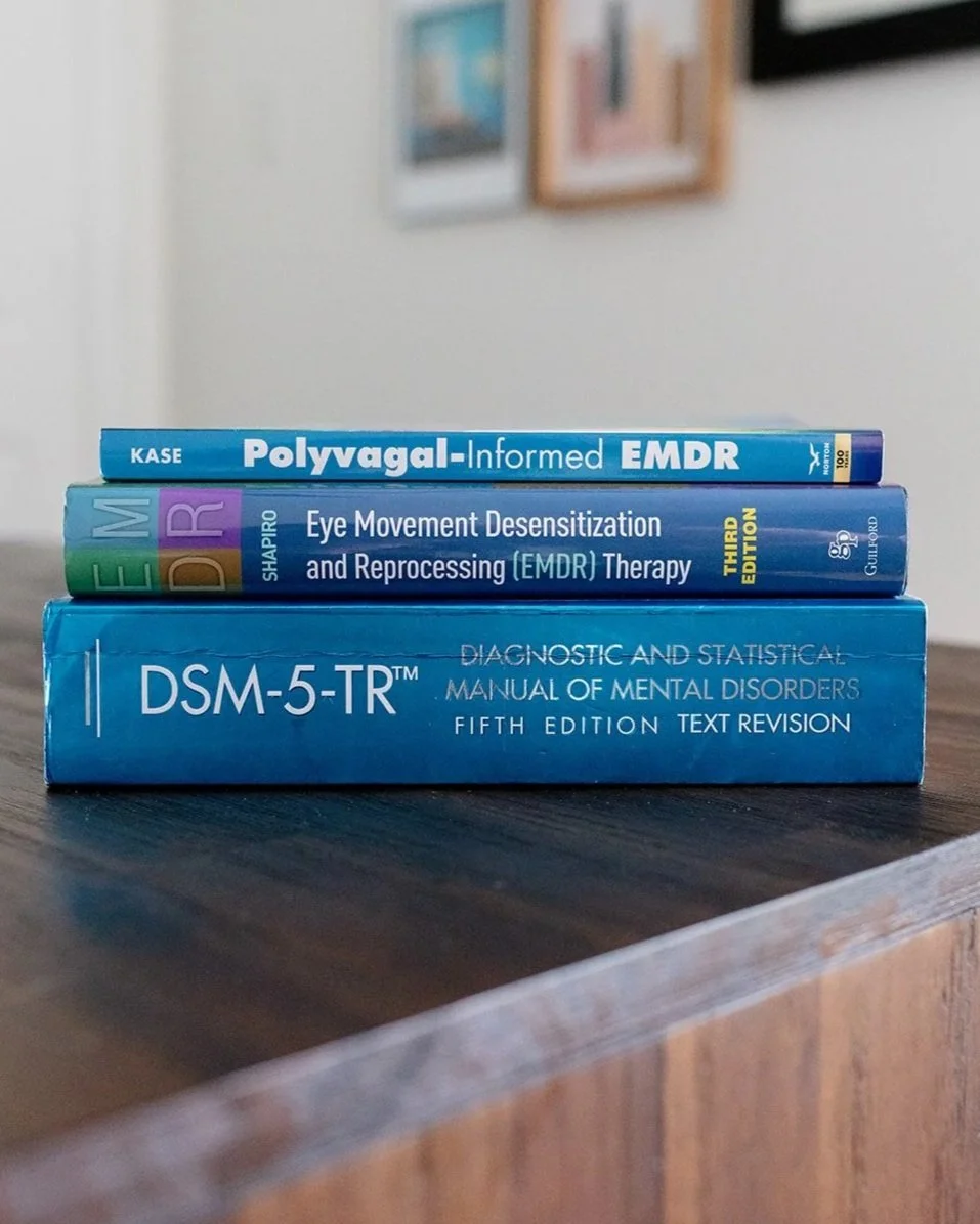 EMDR, Polyvagal-Informed EMDR, and DSM-5-TR reference books used in trauma therapy