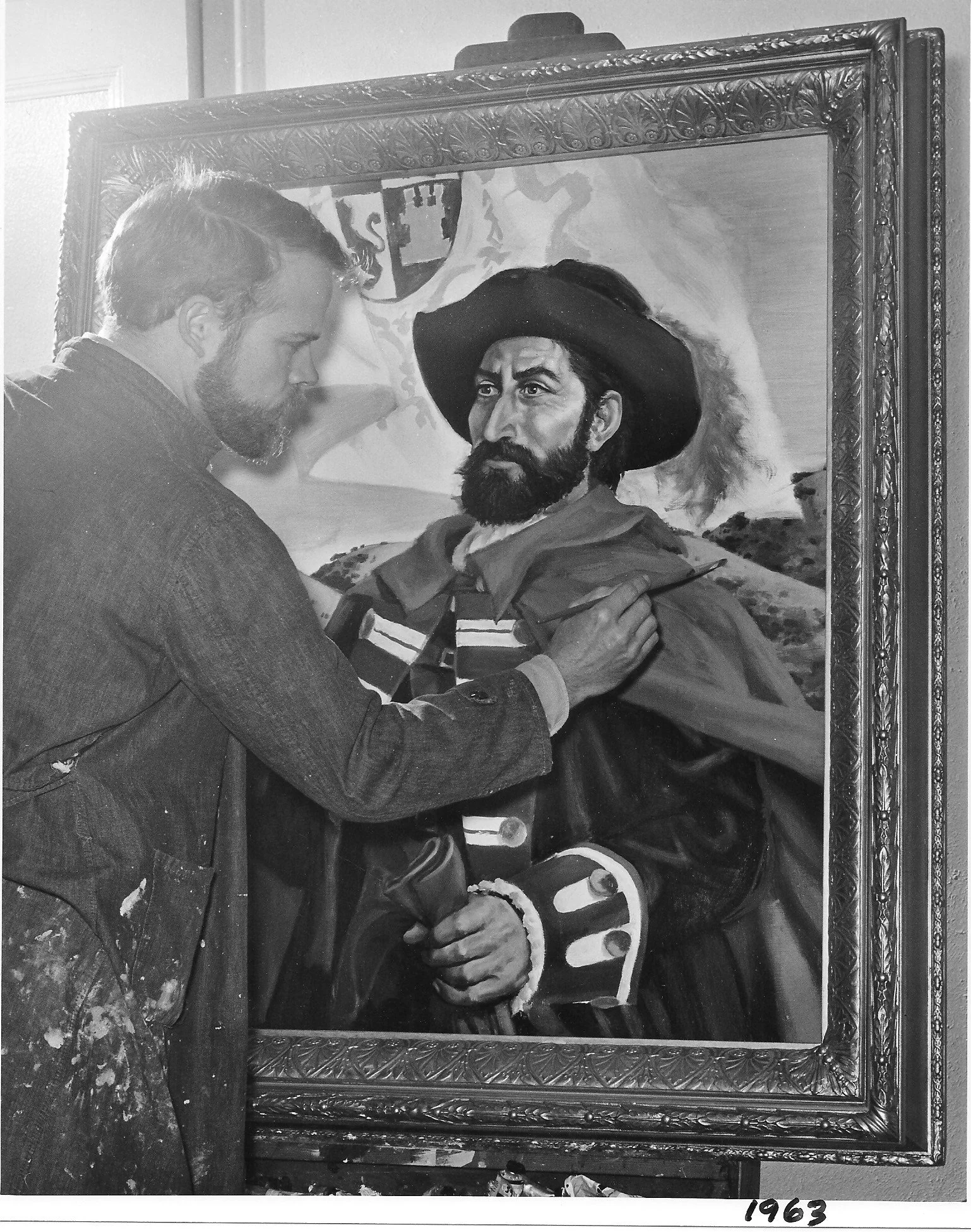 Photo of Robert McClay painting a historical portrait of Juan Bautista de Anza in 1963.