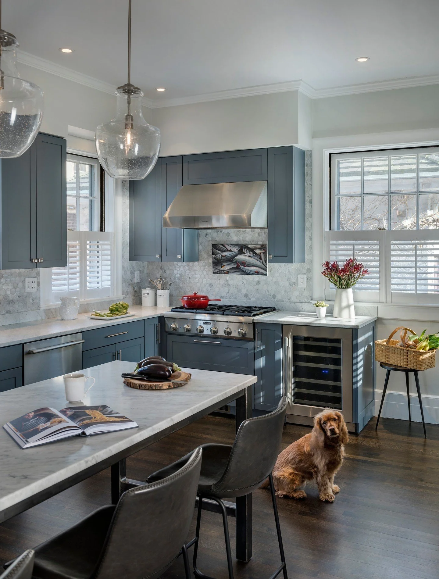 Two phases. Two years. One Blackstone Boulevard home was brought back to the gold standard it deserved. It started here &mdash; in the kitchen. ⁠
⁠
Blue-gray cabinetry, new countertops, backsplash, and lighting, with an open layout to the dining room